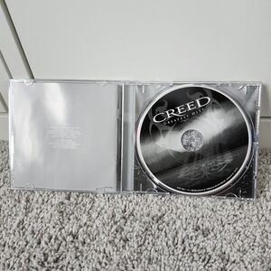 Creed Greatest Hits CD - Black and Silver